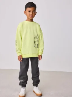 Jaune citron - Baker by Ted Baker Ensemble sweat-shirt et jogging graphique surdimensionné