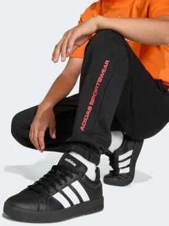 Jogging adidas en polaire à slogan